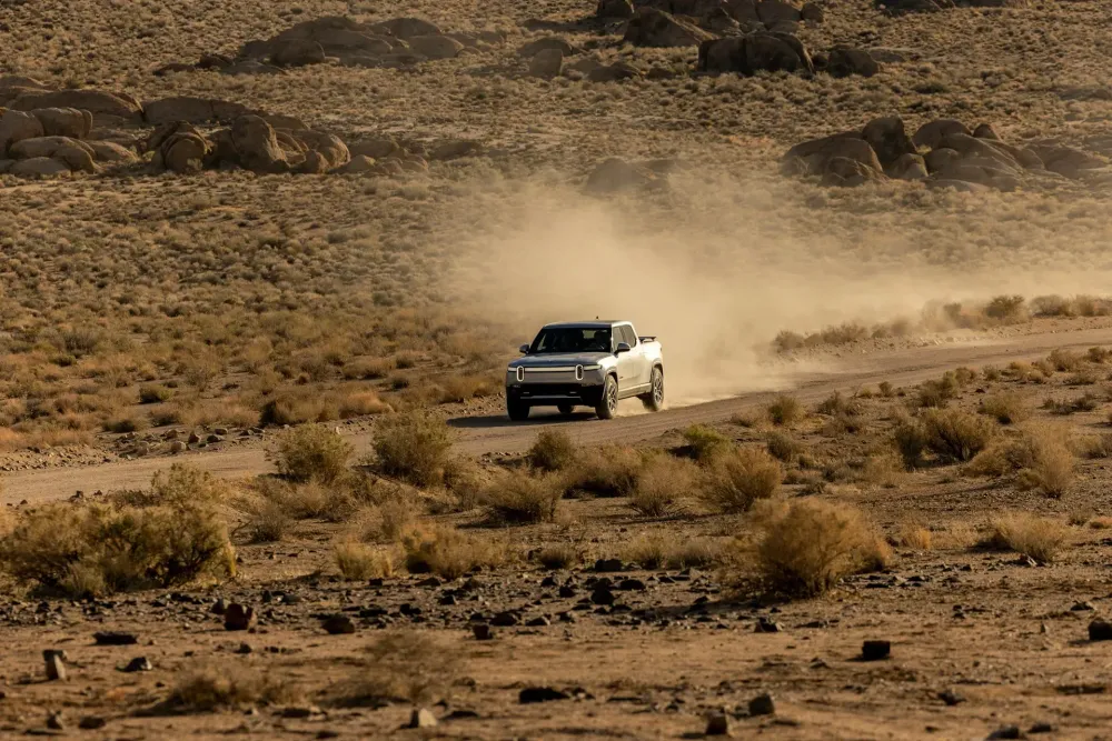 Car driving on an open highway representing how to plan a successful road trip.