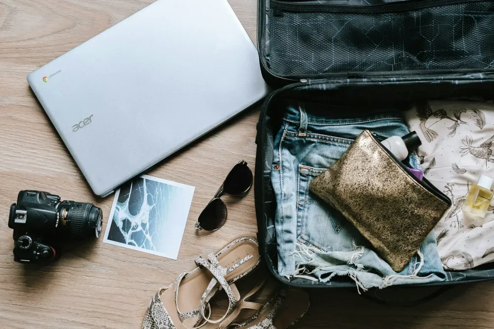 Road trip packing checklist accessories organized neatly on table.